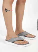 A-man-lightweight-Grey-medicated-flip-flops-with-thick-white-sole-and-soft, comfortable thong strap.