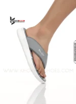 A-man-lightweight-Grey-medicated-flip-flops-with-thick-white-sole-and-soft, comfortable thong strap.