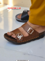 A pair of men's stylish two-strap sandals, with one in a dark brown color and the other in a deep blue-grey.