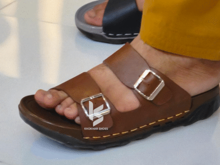A pair of men's stylish two-strap sandals, with one in a dark brown color and the other in a deep blue-grey.