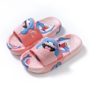 A pair of bright blue and light blue kids' slides with a cheerful 3D shark design on the straps, and small shark cartoon patterns on the footbeds. The slippers have thick, comfortable-looking soles.