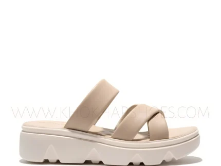 Women wearing beige cross-strap comfort sandals with cushioned sole