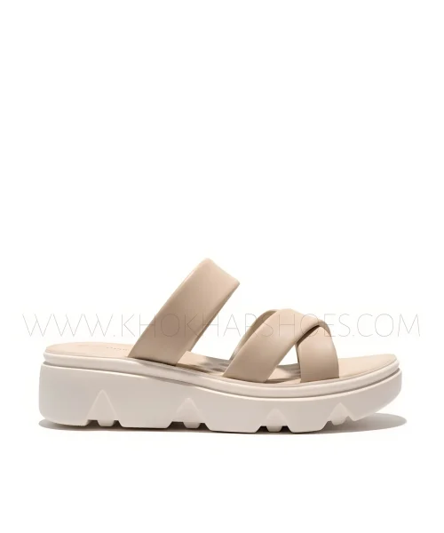 Women wearing beige cross-strap comfort sandals with cushioned sole
