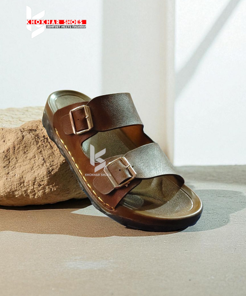 A pair of men's stylish two-strap sandals, with one in a dark brown color and the other in a deep blue-grey.